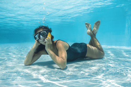 Woman on phone in the pool